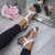 Model wearing White PU Low Mid Wedge Heel T-Bar Flower Diamante Sandals