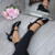 Model wearing Black Patent Mid Heel Mary Jane Court Shoes Model wearing Black Patent Mid Heel Mary Jane Court Shoes