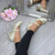 Model wearing Gold Glitter Mid Heel Mary Jane Court Shoes Model wearing Gold Glitter Mid Heel Mary Jane Court Shoes