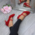 Model wearing Red Suede Mid Heel Mary Jane Court Shoes Model wearing Red Suede Mid Heel Mary Jane Court Shoes