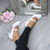 Model wearing White PU Mid Heel Mary Jane Court Shoes Model wearing White PU Mid Heel Mary Jane Court Shoes