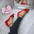 Model wearing Red Suede Low Mid Wedge Heel Ankle Strap Sandals