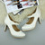 Closeup view of features of Ivory Satin High Heel Platform Mary Jane Court Shoes