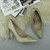 Closeup view of features of Gold Glitter High Heel Pointed Court Shoes
