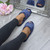 Model wearing Navy Fur Memory Foam Fluffy Quilted Fur Lined Grip Sole Peep Toe Mule Slippers Sandals