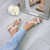 Model wearing Beige PU Mid Wedge Heel Diamante Beaded T-Bar Slingback Sandals
