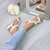 Model wearing White PU Mid Wedge Heel Diamante Beaded T-Bar Slingback Sandals