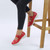 Model wearing Red PU Flat Grip Sole Padded Mary Jane Hook & Loop Comfort Shoes