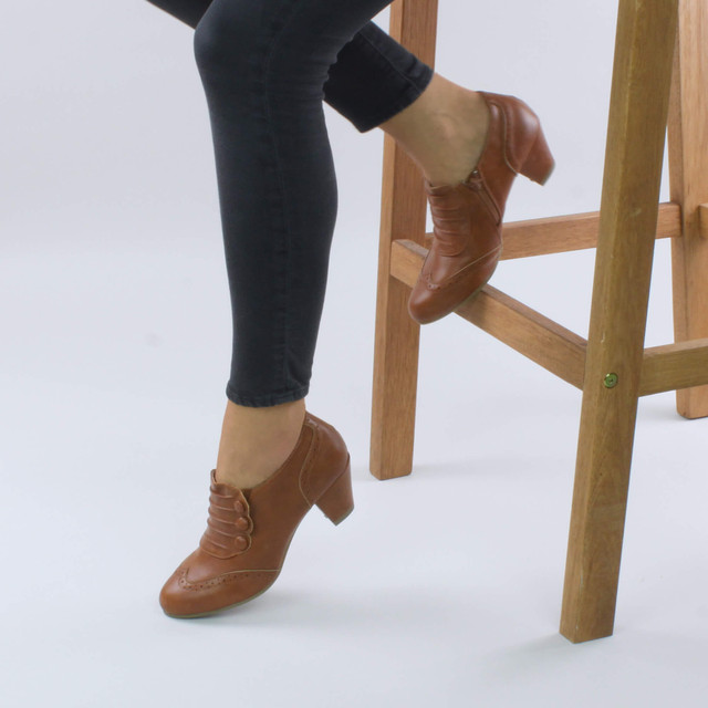 Model wearing Tan PU Mid Heel Buttons Brogue Ankle Boots Booties
