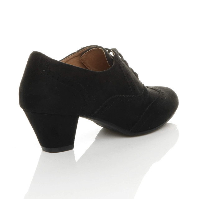 Back right side view of Black Suede Mid Heel Brogue Shoe Boots