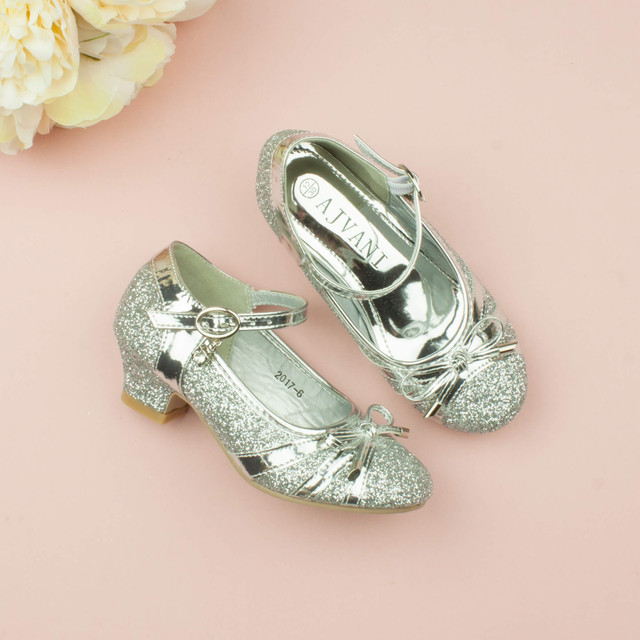 Model wearing Silver Low Heel Bow Diamante Court Shoes