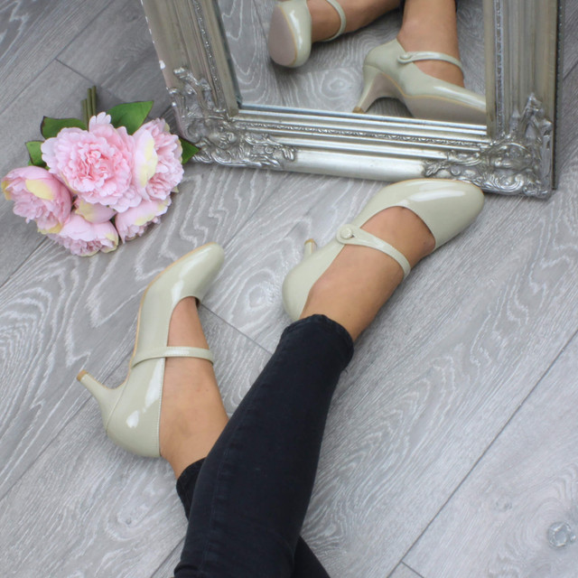 Model wearing Nude Patent Mid Heel Mary Jane Court Shoes