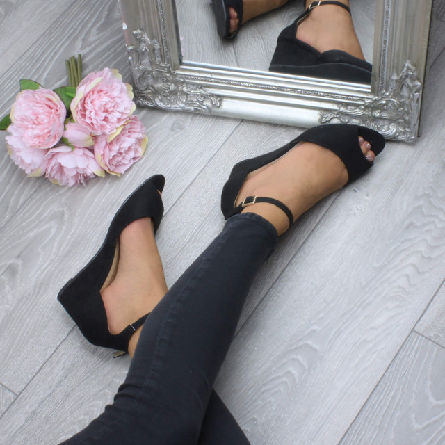 Model wearing Black Suede Low Mid Wedge Heel Ankle Strap Sandals