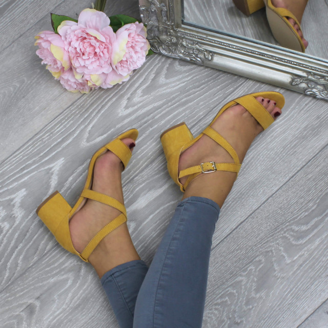 Model wearing Mustard Suede Mid Block Heel Cross Strap Party Strappy Sandals