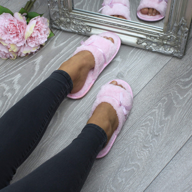 Model wearing Pink Fur Memory Foam Fluffy Bow Fur Lined Grip Sole Peep Toe Mule Slippers Sandals