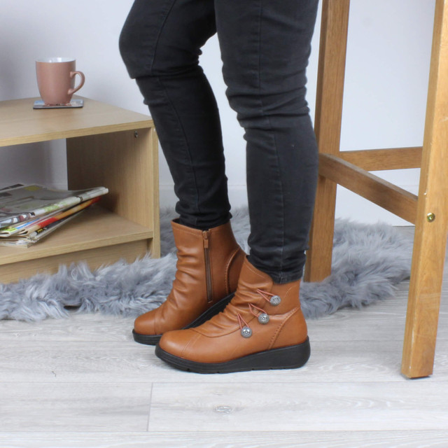 Model wearing Tan PU Low Wedge Heel Button Comfort Ankle Boots