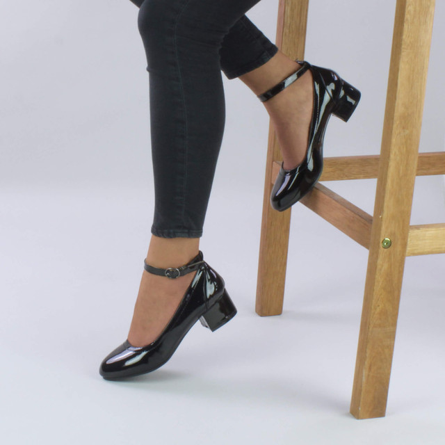 Model wearing Black Patent Low Mid Block Heel Ankle Strap Smart Work Comfort Shoes