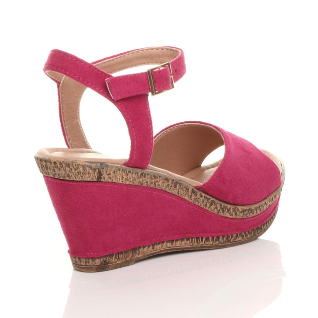 Back right side view of Fuchsia Pink Suede High Wedge Heel Cork Platform Buckle Sandals