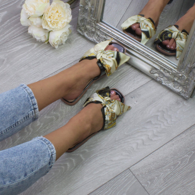 Model wearing Black Flat Slip On Mule Boho Printed Bow Sandals Flip Flops