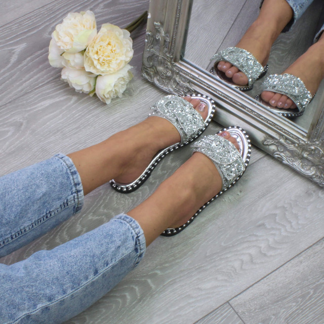 Model wearing Silver PU Flat Slip On Studded Diamante Mules Sandals Flip Flops