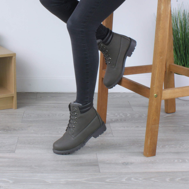 Model wearing Grey PU Low Heel Lace Up Chunky Fur Lined Military Work Ankle Boots 