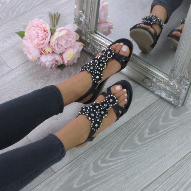 Model wearing Black PU Low Mid Wedge Heel Flower Diamante T-Bar Slingback Sandals