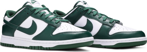 The Nike Dunk Low ‘Michigan State’ delivers a low-top version of the Michigan State Dunk from 2020. Like its predecessor, the shoe features a two-tone all-leather upper rendered in classic ‘Be True to Your School’ color blocking. A stark white finish is contrasted by a dark green Swoosh and matching overlays at the toe and heel. Standard Nike branding hits decorate the heel and nylon tongue. The low-top is mounted on a durable rubber outsole, complete with a traction pattern originally developed for the hardwood.