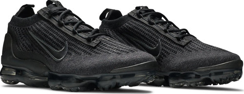 The Nike Air VaporMax 2021 Flyknit ‘Triple Black’ presents a monochromatic rendition of a lifestyle runner predicated on comfort and sustainability. A stitched-on Swoosh adorns the black Flyknit upper, composed of post-industrial recycled yarn and supported with a recycled TPU heel clip. Dual pull tabs and an elastic sock-like collar enable easy on and off. The sneaker sits on a low-profile Air-sole unit that runs the length of the rubber outsole, made in part with Nike Grind.