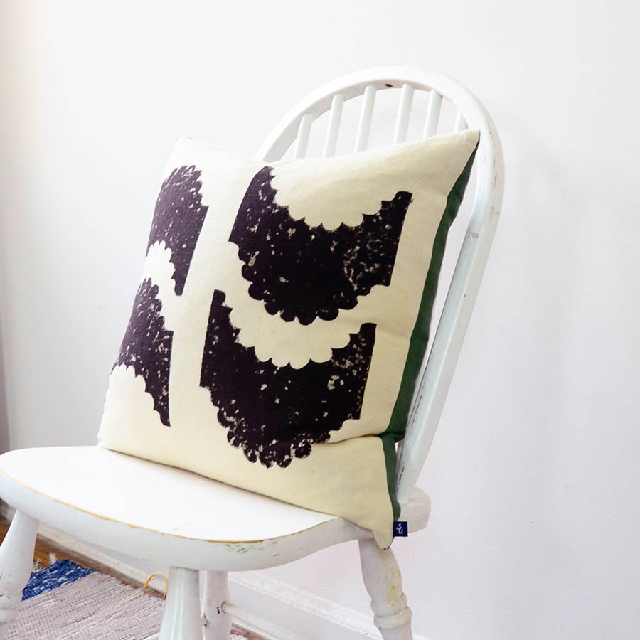 reversible black and beige pillow