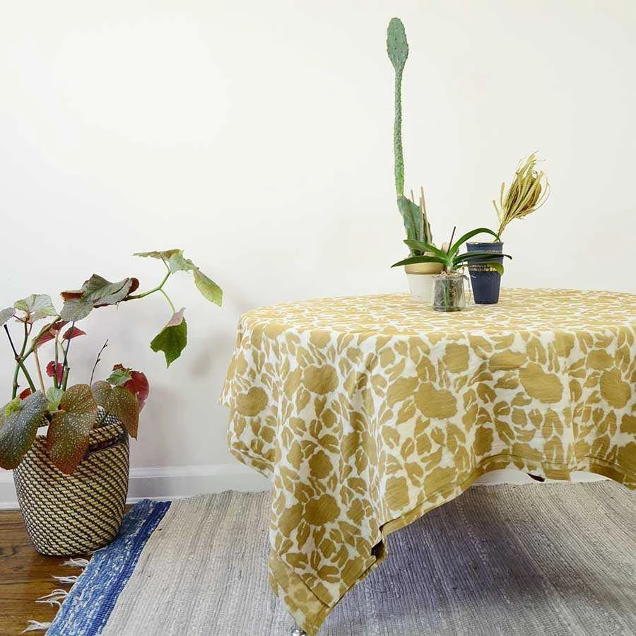 Block Print Mustard Yellow Tablecloth used on a round table.