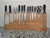 Extra-large magnetic knife block in reclaimed Australian hardwood, holding a twelve-piece set with cleaver and kitchen shears