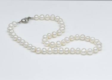 A timeless classic freshwater pearl necklace with sterling silver heart clasp