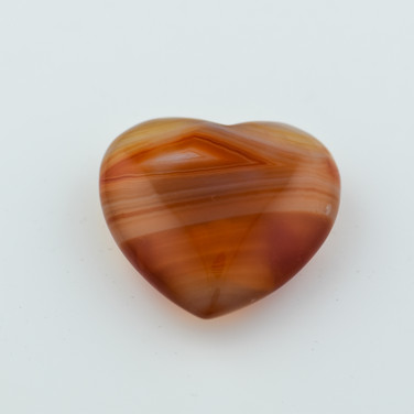 Hand carved banded carnelian crystal heart