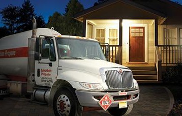 Propane Delivery Truck at a Home to Fill the Tank