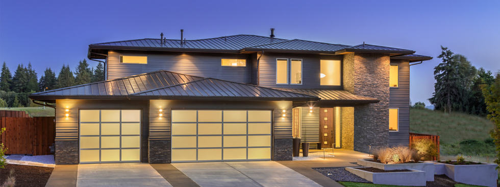A Well Maintained Home Standby Generator Restores Power in Seconds A home with all the lights on during a power outage.