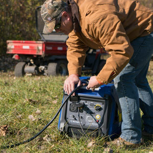 Man with Westinghouse iGen4500 in a Field