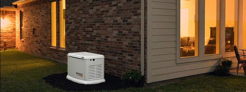 Generac Home Standby Generator Installed Outside a Home with Lights during an outage