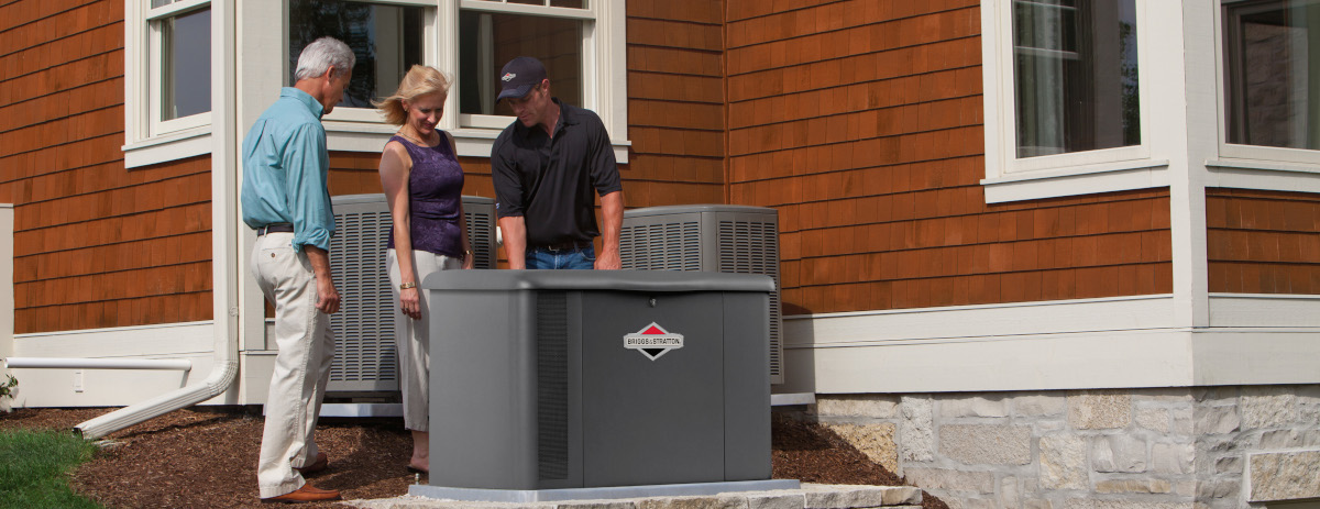 Homeowners discuss their new Briggs and Stratton Household Generator with the installer.