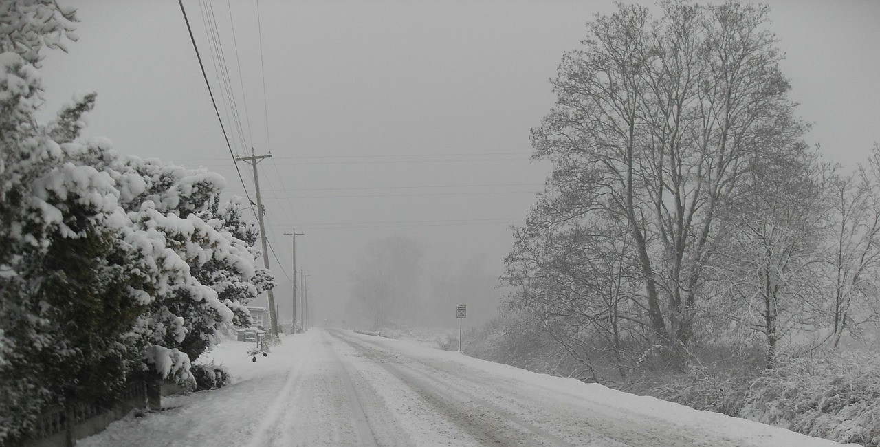 Winter A road in winter approaches whiteout conditions during a blizzard