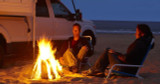 Beach campsite bonfire with the Onan 2800i installed in a truck camper.