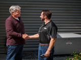 Homeowner and Installer after the new 26kW Briggs and Stratton Generator and Dual 200 Amp Transfer Switch Installation