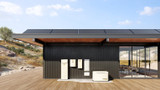 Solar Powered Home with PWRzone rooftop components, PWRCell Battery Storage, PWRcell Inverter, PWRcell Automatic Transfer Switch, PWRmanager with circuit breaker panel, and PWRgenerator.