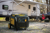 Champion 8500 Dual Fuel Inverter Generator Powers a Travel Trailer RV at a Remote Site