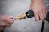 The Propane Tank Hose Extension Brass Fitting Being Connected to the Propane Regulator 