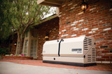 A Champion 22kW Generator Installed on a Brick Patio Outside a Brick Home