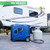 DuroMax 4500 Watt Inverter Generator Dual Fuel Remote Start with RV ready outlet connected to an LP Tank and Travel Trailer