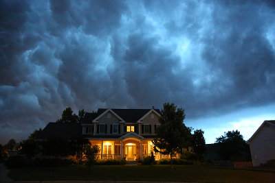 A Thunderstorm Approaches a Home Equipped with a Cummins Quiet Connect Generator