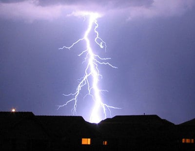 Lightning Strikes Near a Home During a Severe Thunderstorm