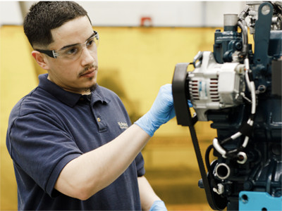 A Kubota Technician inspects a Generator Engine