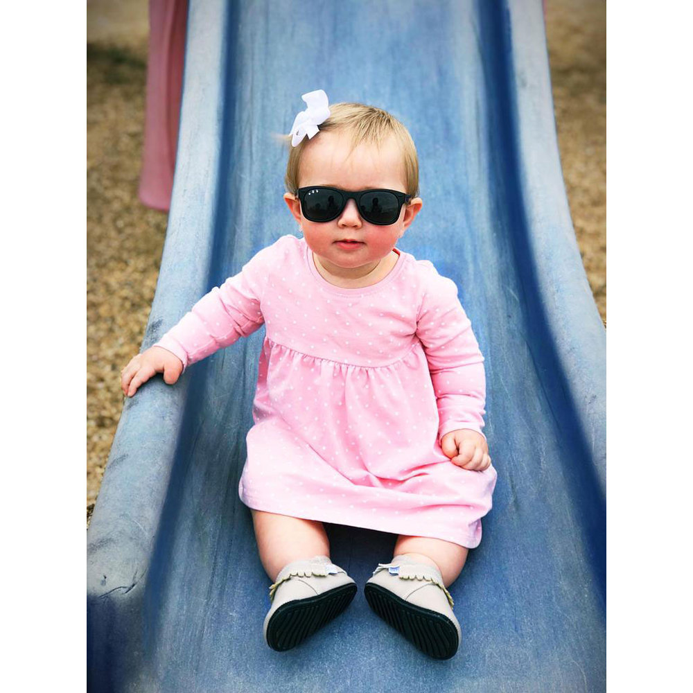 polarized toddler shades, black bueller, baby girl on slide